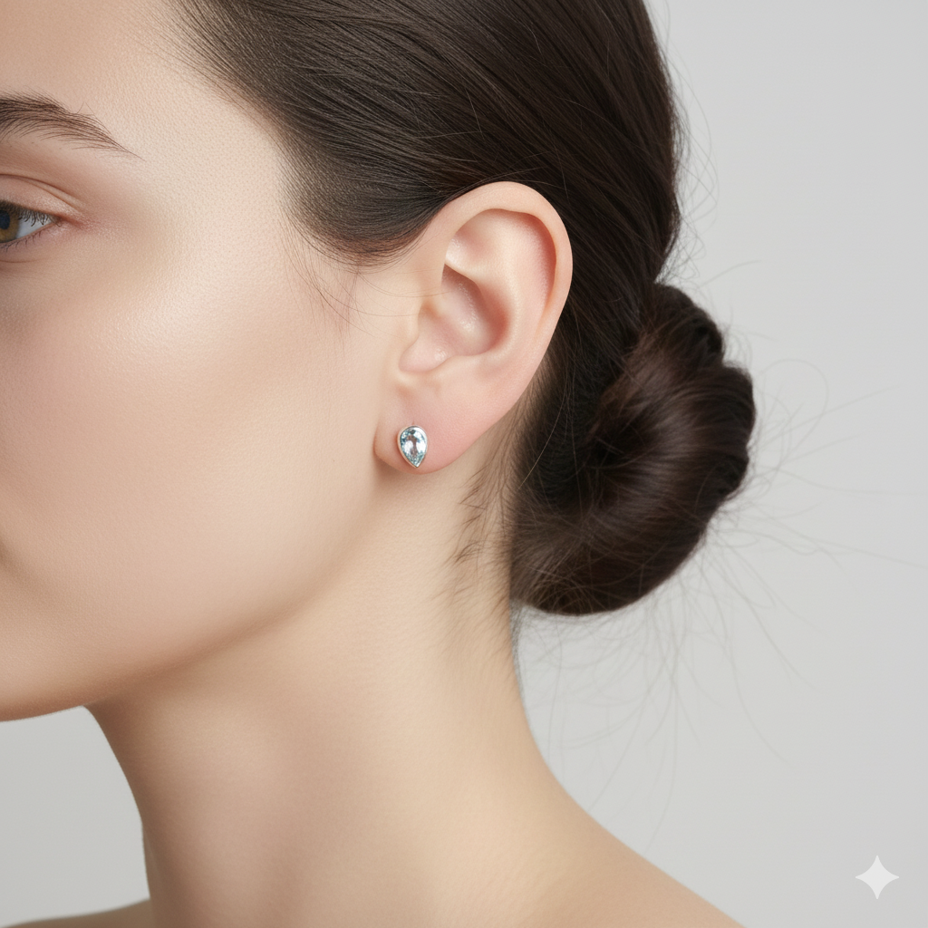 Ohrstecker tropfenform Blauer Topas in Silber gefasst